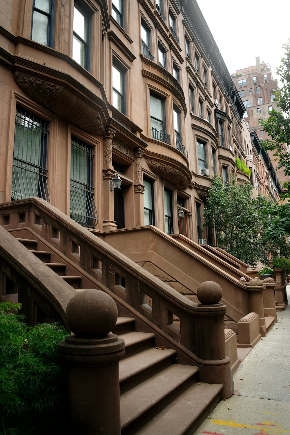 Brownstone homes along a New York residential street